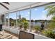 Screened patio with lake view, plants, and tiled floor at 2076 Shannon Lakes Blvd, Kissimmee, FL 34743