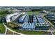 Aerial view of the neighborhood with white townhomes, parking and green space at 2290 Brix Sts, Orlando, FL 32804