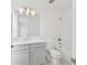 The bathroom has a gray vanity, with white countertops, and a shower and bath combination at 2290 Brix Sts, Orlando, FL 32804