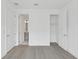 Bedroom featuring light-colored floors, closet, and bathroom access at 2290 Brix Sts, Orlando, FL 32804