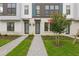 Inviting entrances with manicured lawns and paved walkways lead to modern townhomes at 2290 Brix Sts, Orlando, FL 32804