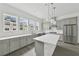 Modern kitchen with large island, stainless steel appliances, and bright countertops at 2290 Brix Sts, Orlando, FL 32804