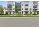 Modern townhomes boast striking architecture, lush landscaping, and inviting entryways at 2290 Brix Sts, Orlando, FL 32804