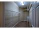 Organized walk-in closet with shelving, maximizing storage space and providing efficient organization for clothes and accessories at 2673 Rutledge Ct, Winter Haven, FL 33884