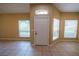 Bright entryway featuring neutral walls, tile flooring, and ample natural light from large windows at 2673 Rutledge Ct, Winter Haven, FL 33884