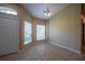 Inviting entryway with tile flooring, natural light, and neutral paint, creating a warm and welcoming atmosphere at 2673 Rutledge Ct, Winter Haven, FL 33884