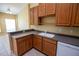 Well-equipped kitchen boasts wood cabinets, generous countertops, and a convenient layout, perfect for cooking and entertaining at 2673 Rutledge Ct, Winter Haven, FL 33884