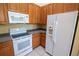 Efficient kitchen design featuring matching white appliances and ample cabinet space, ideal for everyday meal preparation at 2673 Rutledge Ct, Winter Haven, FL 33884