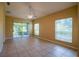 Bright living room with tile flooring, sliding door access to the lanai, and natural light, offering a comfortable living space at 2673 Rutledge Ct, Winter Haven, FL 33884