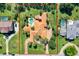 Property line marked on the photo showing the boundaries of the home surrounded by pristine landscaping and greenery at 3130 Butler Bay N Dr, Windermere, FL 34786