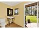 Powder room featuring a pedestal sink, outdoor access, and ample natural light with views of the backyard at 3130 Butler Bay N Dr, Windermere, FL 34786