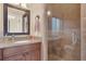 Modern bathroom featuring a granite countertop vanity and frameless glass shower at 3130 Butler Bay N Dr, Windermere, FL 34786
