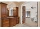 Bathroom featuring a wood vanity and an open view to the main bedroom at 3130 Butler Bay N Dr, Windermere, FL 34786