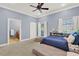 Bedroom featuring natural light, a ceiling fan, and neutral colors, offering a comfortable and inviting space at 3130 Butler Bay N Dr, Windermere, FL 34786
