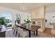Formal dining room with decorative chandelier, fireplace, large windows and area rug at 3130 Butler Bay N Dr, Windermere, FL 34786