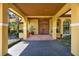 Inviting entrance with elegant double doors, stone brick steps, and a covered porch at 3130 Butler Bay N Dr, Windermere, FL 34786
