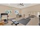Spacious home gym with carpet, lots of natural light, ceiling fan, and ample space for workout equipment at 3130 Butler Bay N Dr, Windermere, FL 34786