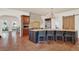 Open concept kitchen with an island, stone countertops, and tile flooring at 3130 Butler Bay N Dr, Windermere, FL 34786