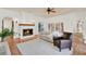 Comfortable living room with terracotta floors, a fireplace, and a cozy seating area at 3130 Butler Bay N Dr, Windermere, FL 34786