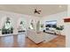 Spacious living room featuring tile floors, large windows, and bright natural light at 3130 Butler Bay N Dr, Windermere, FL 34786