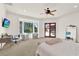 Main bedroom featuring a ceiling fan, desk, bay window and backyard views at 3130 Butler Bay N Dr, Windermere, FL 34786