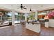Beautiful patio features an outdoor kitchen, tiled flooring, and a refreshing view of the inviting pool area at 3130 Butler Bay N Dr, Windermere, FL 34786