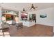 Entertainer's patio complete with outdoor kitchen, ceiling fans, and expansive views of the surrounding landscape at 3130 Butler Bay N Dr, Windermere, FL 34786