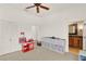 Spacious playroom featuring neutral carpets, white walls, toy storage and access to a full bathroom at 3130 Butler Bay N Dr, Windermere, FL 34786
