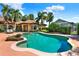 Beautiful backyard featuring a pool, spa, lush landscaping, and serene views for ultimate relaxation and enjoyment at 3130 Butler Bay N Dr, Windermere, FL 34786
