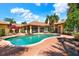 Serene backyard featuring a large swimming pool, spa, and mature trees, ideal for relaxing and entertaining at 3130 Butler Bay N Dr, Windermere, FL 34786