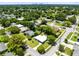 Beautiful home nestled among mature trees with easy access to community amenities, including a nearby lake at 3515 Leslie Dr, Orlando, FL 32806
