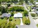 Charming single-story home featuring mature trees, a well-maintained lawn, and a neighborhood with sidewalks at 3515 Leslie Dr, Orlando, FL 32806