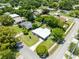Residential home featuring mature trees, green lawn, quiet street, and proximity to nearby amenities at 3515 Leslie Dr, Orlando, FL 32806
