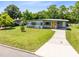 Charming home featuring a bright yellow front door, a walkway and lawn at 3515 Leslie Dr, Orlando, FL 32806