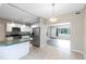 Bright kitchen features stainless appliances and an eat-in breakfast bar at 3515 Leslie Dr, Orlando, FL 32806