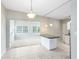 Eat-in kitchen featuring a peninsula and a view to a living room at 3515 Leslie Dr, Orlando, FL 32806