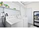 Neat laundry room featuring a washing machine and dryer at 3515 Leslie Dr, Orlando, FL 32806