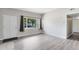 Inviting living room with new laminate flooring and ample natural light at 3515 Leslie Dr, Orlando, FL 32806