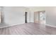 Spacious living room featuring stylish laminate flooring at 3515 Leslie Dr, Orlando, FL 32806