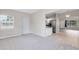 Spacious living room leads to a kitchen with stainless steel appliances at 3515 Leslie Dr, Orlando, FL 32806