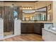 Well-appointed bathroom featuring a glass-enclosed shower with unique tile and a marble countertop vanity at 3619 King George Dr, Orlando, FL 32835