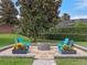 This firepit has a stone border and features chairs for cozy evenings under the stars at 3619 King George Dr, Orlando, FL 32835