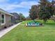 Enjoy backyard entertaining at this firepit with seating and beautiful landscaping at 3619 King George Dr, Orlando, FL 32835