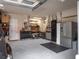 Spacious garage with ample storage, work bench, and a refrigerator at 3619 King George Dr, Orlando, FL 32835