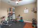 Well-equipped home gym featuring various exercise machines and equipment, ideal for fitness enthusiasts at 3619 King George Dr, Orlando, FL 32835
