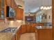 Well-equipped kitchen with stainless steel appliances, granite countertops, and tile backsplash at 3619 King George Dr, Orlando, FL 32835