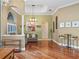 Inviting living room showcasing hardwood floors, stylish lighting, and a comfortable seating area with neutral decor at 3619 King George Dr, Orlando, FL 32835