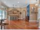 Spacious living room with hardwood floors, a custom bar area, and an open layout perfect for entertaining guests at 3619 King George Dr, Orlando, FL 32835