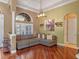 Comfortable living room featuring hardwood floors, a large window, and a neutral color scheme with decorative accents at 3619 King George Dr, Orlando, FL 32835