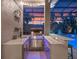 Outdoor kitchen with grill, bar, and sink offers sunset views by the pool at 3619 King George Dr, Orlando, FL 32835